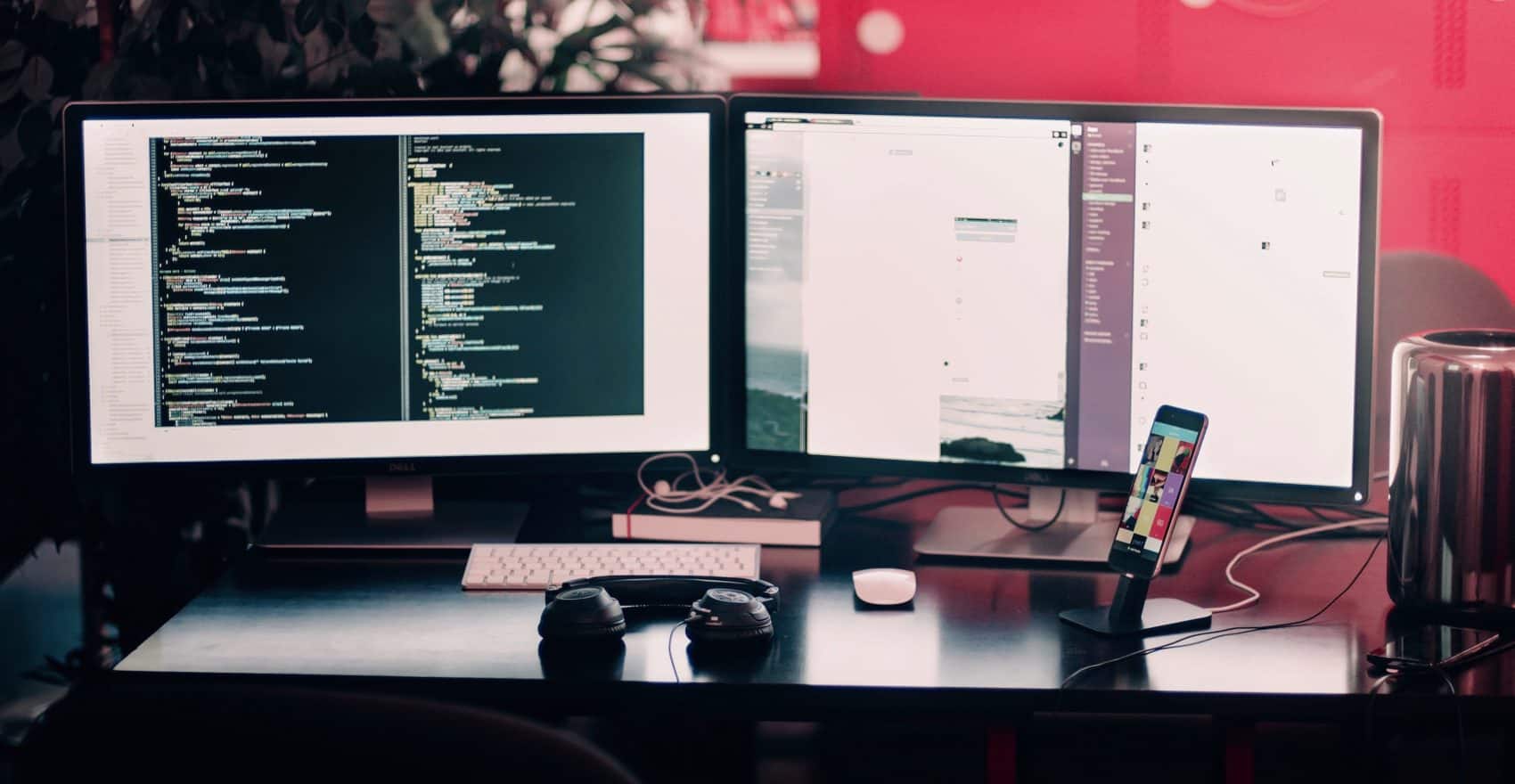 2 sreens with code, slack and email opened