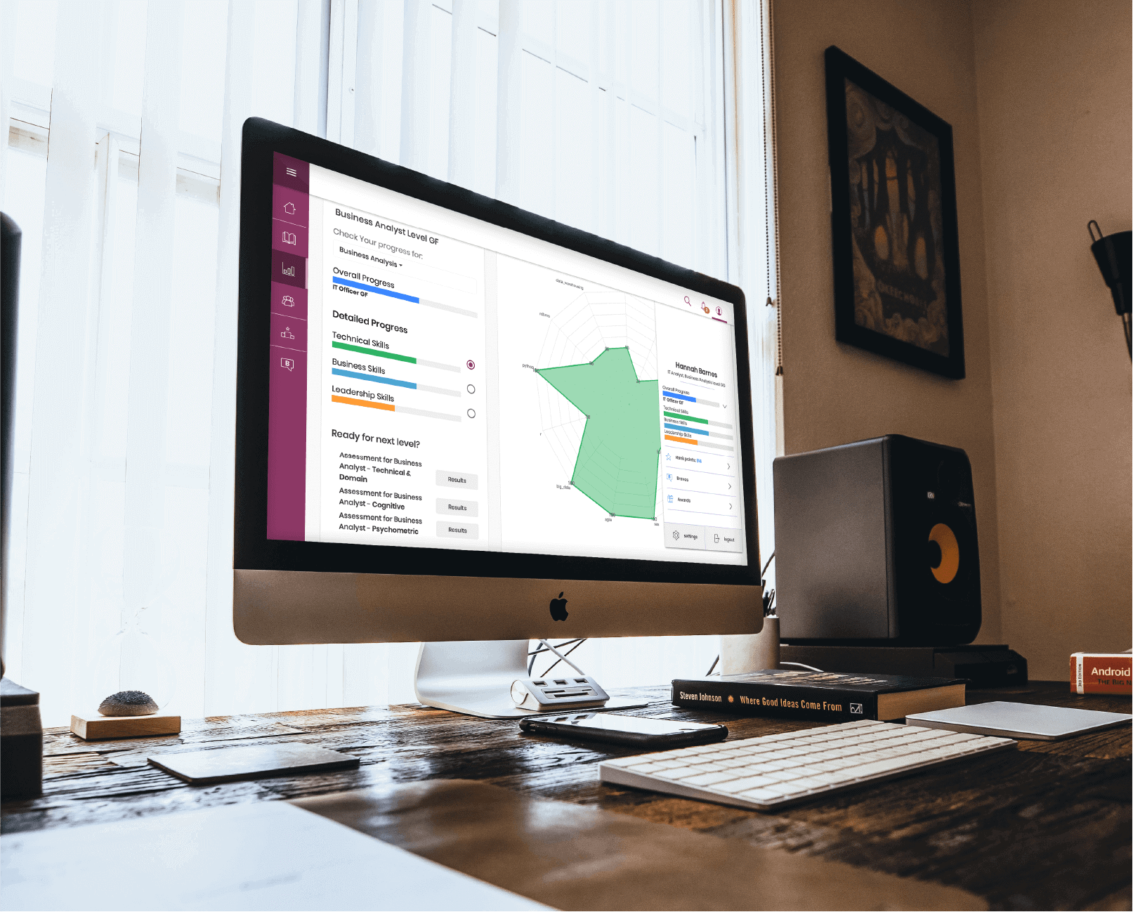 Desktop monitor displaying a skill assessment screen for a Business Analyst, including a radar chart.