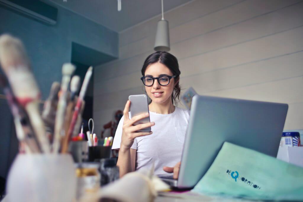 Young women with her phone representing the process of effective communication