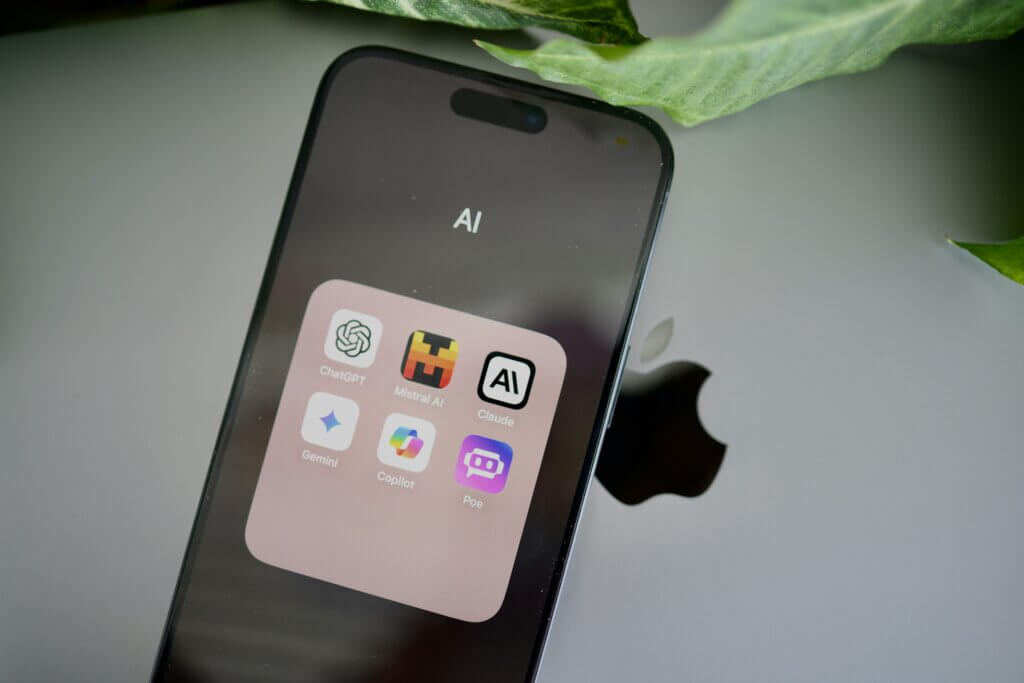 Smartphone screen showing AI assistant apps used as references for building AI copilots