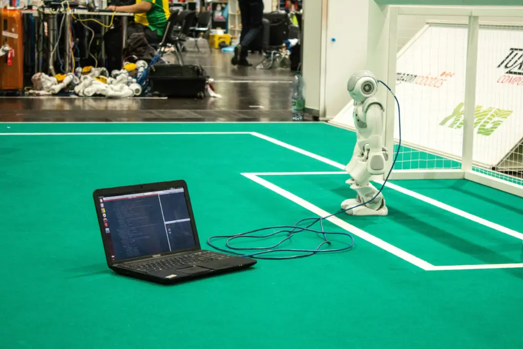 Robot prototype and laptop used to validate ideas in an AI Discovery Workshop