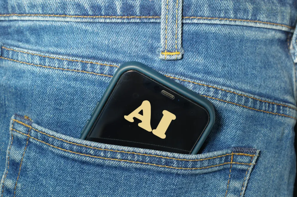 AI Agent displayed on a smartphone tucked into a jeans pocket