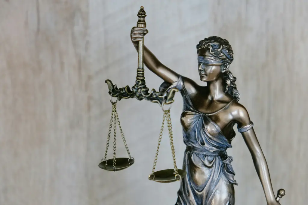 Lady Justice holding scales symbolizing AI Act regulation and legal compliance